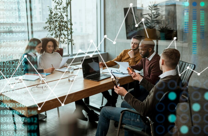 A team meeting around a table with a rising line chart overlaid